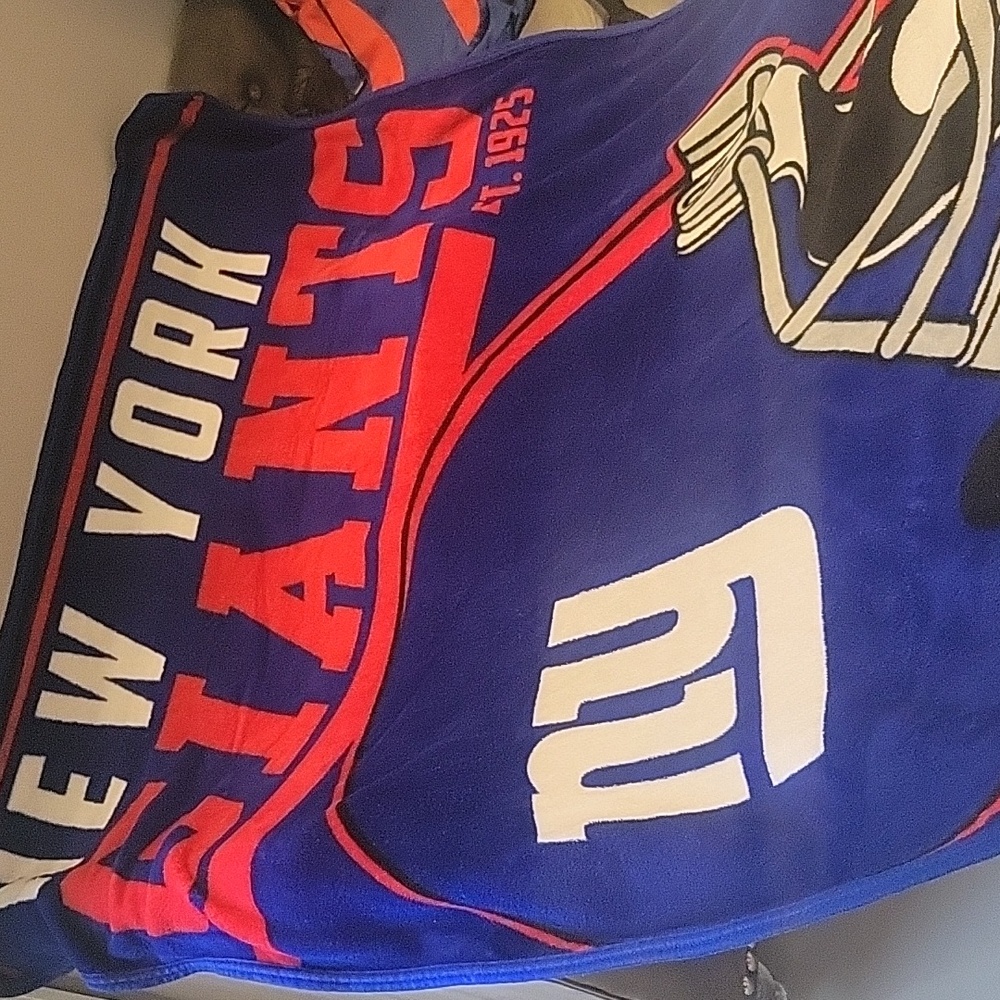Giants blanket and throw pillow, Giants seat cushion, and a free Giants backpack